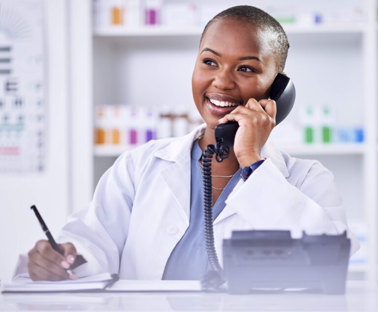 black-woman-pharmacist-and-phone-call-for-telehea-2023-07-14-08-31-19-utc